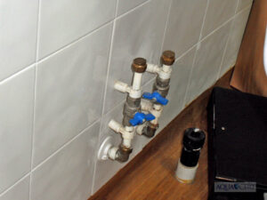 Hot and cold deadleg pipework remaining after a wash hand basin has removed